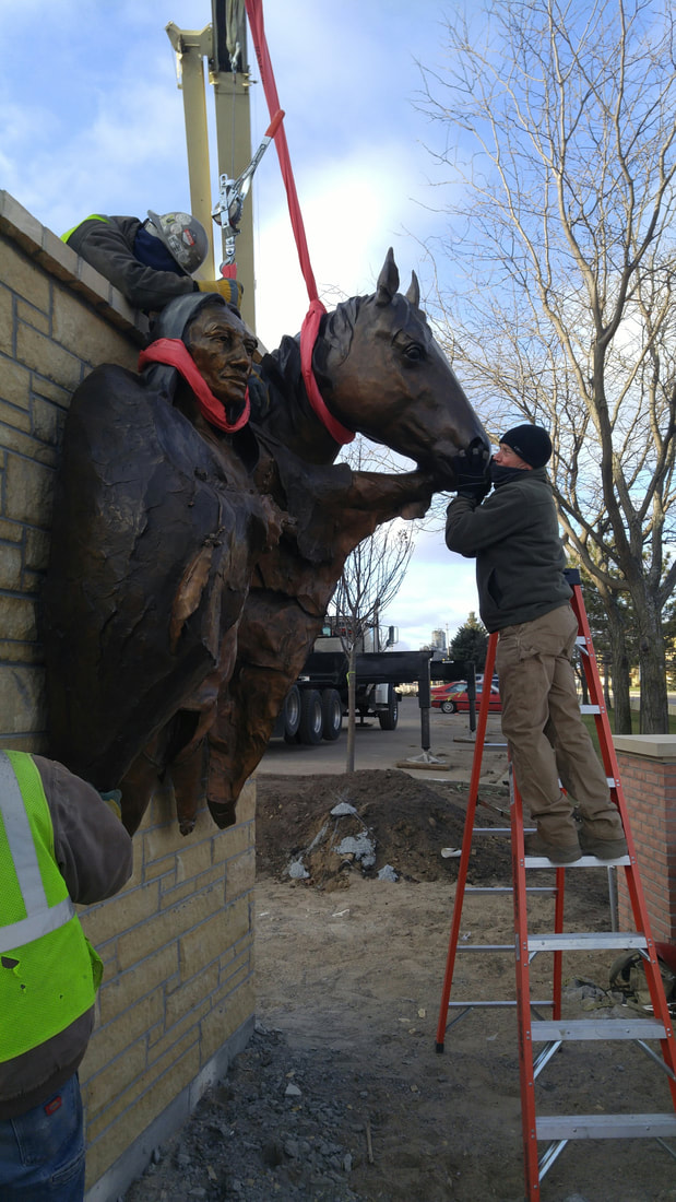 John Kinkade and Denny Haskew of the National Sculptors' Guild are in Shakopee, MN to install Chief Shakopee at the entrance of the city .   Working quickly this morning in 27-degree temps, the NSG and Shakopee team secured the 7-foot by 9-foot bronze bas-relief to it's new home.   Denny was inspired by a quote from Chief Sakpe, 