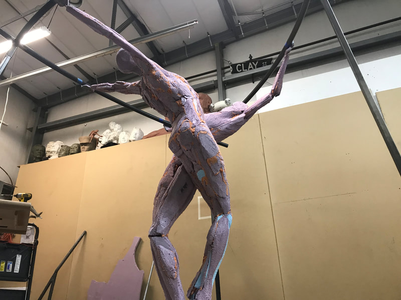Coming soon to Downey, California...
​"Tree of Life" by Clay Enoch and the National Sculptors' Guild is in the finishing steps of bronze casting at Art Castings of Colorado.

This installation is part of a series of Public Art placements that the City has commissioned from the National Sculptors' Guild for installations in 2020. The bronze and stainless steel sculpture will be placed in a  the new fountain at the Theater Plaza.

Our design team began working on this project in March of 2019.

Measuring 12-feet tall and 14-feet in diameter, the tree composed of eight life-size bronze figures out stretched from a single column are united by the stainless steel rings they hold; this sculpture is among our most complex figurative monuments to date. We are so excited to see this significant art statement in place. We will update this post as soon as installation is set.

Progression of the project is shown below...