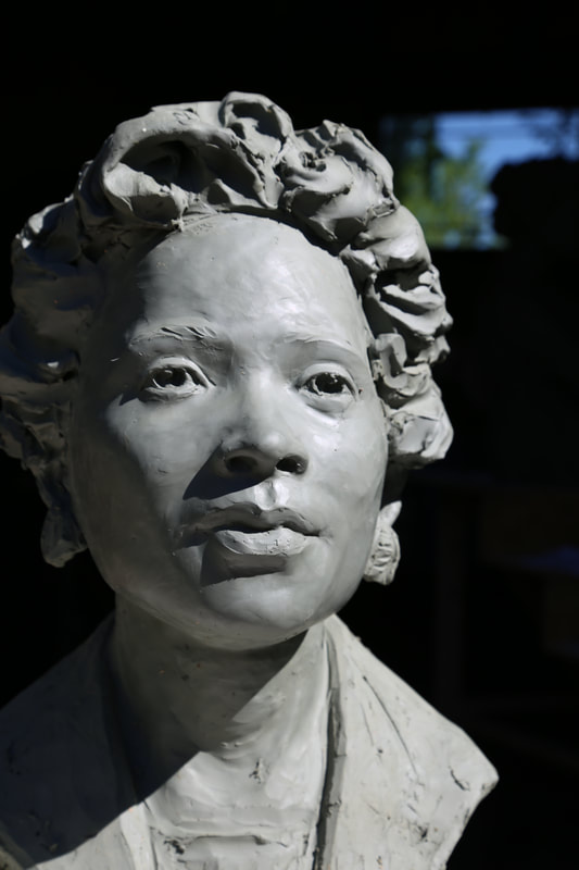 National Sculptors' Guild Fellow Jane DeDecker has been selected to sculpt Daisy Lee Gatson Bates for placement in the City of Little Rock, Arkansas. The honor to portray such an important figure is a true highlight. 

The life-sized bronze bust will be accompanied by bronze plaques featuring quotations by the great Civil Rights Activist.

​The public display of her image and words will serve well to inspire next generations to take her lead to end racial injustice.

​"I have been truly inspired and deeply moved by the strength and dedication of Daisy Lee Gatson Bates. She turned tragedy into her life's work in fighting against prejudice, segregation, and inequality. Daisy Lee Gatson Bates was a formidable woman who would not stand down." - Jane DeDecker, NSG

The commemorative placement will be completed in 2022. Updates will be posted here.
​Daisy Bates was an elegant woman, physically small, though grand in stature when her determination to end racial injustice was involved. She confronted racism and adversity from an early age. Personal confrontations led to speaking out and heading large organizations; providing great change for the state of Arkansas, and beyond.

No one prepares to be the face of change for a nation, Daisy Bates took on her role with grace and fortitude. Unwaveringly, she rose to all of the challenges, her diminutive body seemingly too small for the power she exuded. Small but mighty, Mrs. Bates informed and organized Arkansas' Civil Rights movement.

Her resilience to the fear tactics used gave her a reputation of calm in the face of adversity. Jail time, fires on lawns and bricks thrown through windows seemed only to make the fight more just and purposeful.

Though Mrs. Bates is most known for her involvement in the Little Rock Desegregation Crisis of 1957, her contributions etch far deeper. The weekly newspaper that she and her husband published helped inform and activate civil rights movements across the state, and beyond, before and after the integration of Central High School. From 1941 to 1959 the Arkansas State Press was one of the only newspapers solely dedicated to the Civil Rights Movement.

She was known to publish controversial articles that others shied away from. Daisy Bates worked with local Civil Rights organizations including joining the National Association for the Advancement of Colored People in 1952. For many years, she served as the President of the Arkansas chapter of the NAACP, providing support to many opportunities for the black community, assuring her role in the 1957 desegregation efforts.
​
She was well respected in the community, even her opponents had to admit she was a force to reckon with. Her repose during crisis after crisis kept the forward motion of the Civil Rights Movement going; and her tenacious charge afforded generations of students access to their constitutional rights.