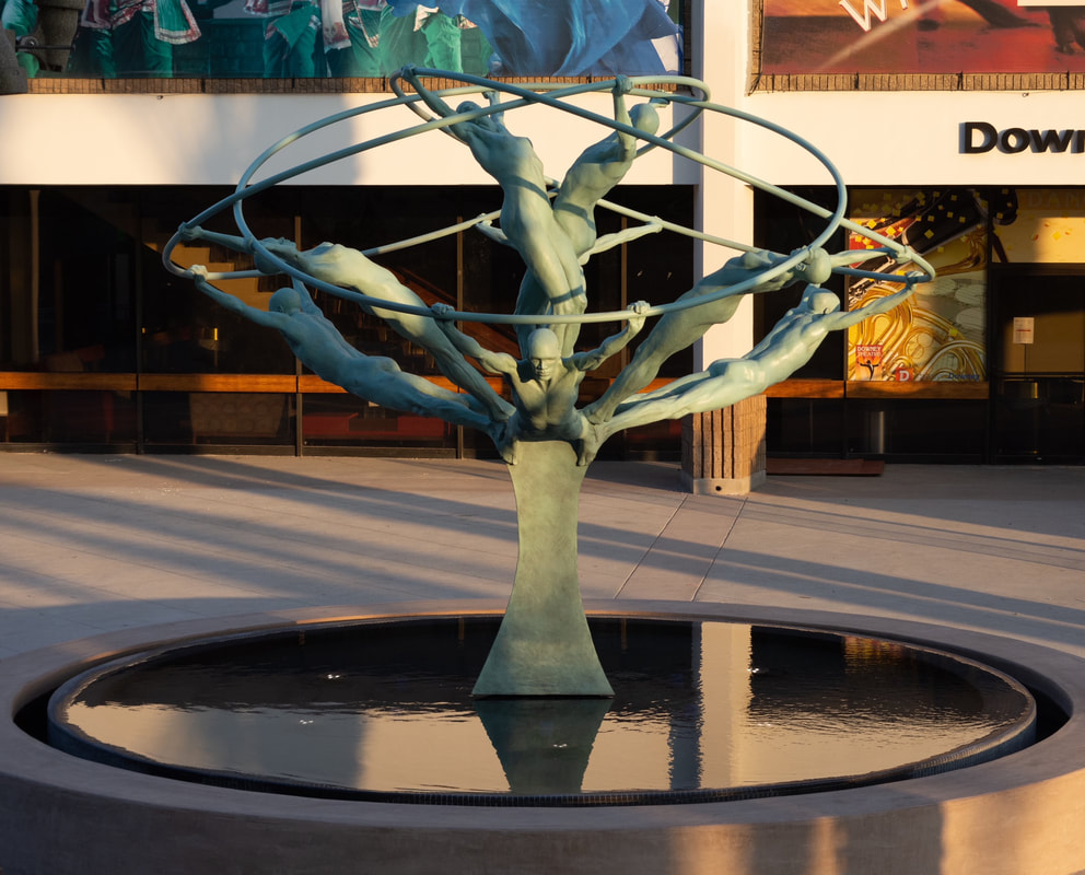 A few more photos from our “Tree of Life” installation in California. “Tree of Life” by Clay Enoch and the National Sculptors’ Guild is in its new home at the center of the new Downey Theatre Plaza fountain. The 14-foot bronze and stainless-steel sculpture features 8 life sized figures gracefully stretching out from a single column and united by huge intersecting rings.  NSG Public Art Placement 524 See more of the entire process here...  http://www.jk-designs-inc.com/.../tree-of-life-in-Downey-ca Special thanks to our Colorado and California team members! Tony Workman and the Art Castings of Colorado staff, Dennis Henderson of DC Crane, John Eisenman Transportation, Zach Pennington of Blackeagle Fabrication, Jim Lambert and Shippers' Supply, Western Steel, Russ Martino and Adam Granath of Martino & Luth, Josef Kekula and the City of Downey, Capital Crane, Andy Garza of Pacific Wood and Iron, and of course Clay Enoch and John Kinkade of the National Sculptors' Guild. 