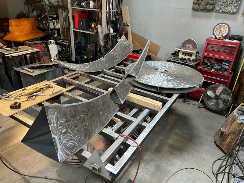 Update 12/1/21: Mark Leichliter's Event Horizon is getting close to completion in metal. Mark has been busy welding and finishing lots of stainless steel.

9/1/2021: We're heading to Paramount, California again soon, the city has just selected Mark Leichliter's Event Horizon for a placement in Para​mount's Progress Park. The 7-foot stainless steel sculpture will join some of our past placements in the same park. The installation is planned for later this year.

"The concept behind the sculpture has to do with the theorized existence of a gravitational border around a black hole beyond which nothing can escape. I wondered what it might look like to see something torn apart but not completely consumed by the black hole; what might the remnants look like as they were spun off into space?"

#NationalSculptorsGuild #NSG #PublicArt #SculptureIsATeamSport #ArtistDriven #ClientMinded