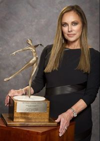 The Peggy Fleming Trophy is awarded for excellence in artistic skating and is presented by Peggy Fleming Jenkins and the Broadmoor Skating Club