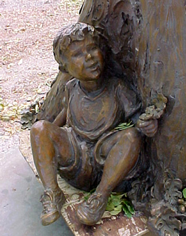 Touch the Sky by Fellow Jane DeDecker and the National Sculptors' Guild was placed through a public art call at 525 E. Bridge Street, Brighton, Colorado.

This bronze sculpture of four children playing on and around a large tree stump was created in 1997. It was conceived to meet the need of a sculpture with children that had enough o fa presence to be placed in a large park and not seem dwarfed by the surroundings. The artist effectively solved this problem by using a large tree stump as a prop. This prop gives the sculpture enough mass to hold its own in the great outdoors. The children on the stump represent a number of emotions that all children have. The girl with hands raised to the sky exudes the exhilaration of the moment. One of the children on the log shows the tentativeness of being on top of the stump. A little boy at the base of the stump is in his own world looking at a bug. In all, the work carries the theme of the circle of life and the many experiences that go with it: from the fallen tree to the children’s exploration of life. The monument is 8’9”H 5’W and5’D. It has been placed at ground level so that children may easily relate to it. Decorative grasses will surround it giving it a naturalized appearance that is appealing year-round.

​NSG Public Art Placement #138