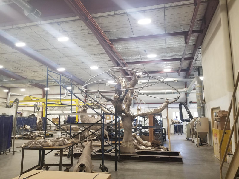 Coming soon to Downey, California...
​"Tree of Life" by Clay Enoch and the National Sculptors' Guild is in the finishing steps of bronze casting at Art Castings of Colorado.

This installation is part of a series of Public Art placements that the City has commissioned from the National Sculptors' Guild for installations in 2020. The bronze and stainless steel sculpture will be placed in a 18-foot diameter fountain at the Theater Plaza.

Our design team began working on this project in March of 2019.

Measuring 12-feet tall and 14-feet in diameter, the tree composed of eight life-size bronze figures out stretched from a single column are united by the stainless steel rings they hold; this sculpture is among our most complex figurative monuments to date. We are so excited to see this significant art statement in place. We will update this post as soon as installation is set.

Progression of the project is shown below...