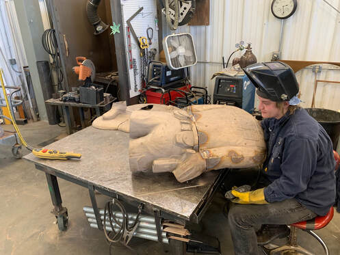 Update 2/7/2024:  The figures come back to life in metal chasing, all the puzzle pieces of Gary Alsum's sculptures  are coming together at Bronze Services in Loveland, Colorado. Next will be the patina to finish off the bronze portion of this project  Meanwhile, the granite walls are being etched in Vermont, and we're preparing the California site. It takes a village on this one. We're so pleased to work with great companies throughout the US.