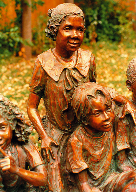 National Sculptors' Guild public art placement 6 Snapshot by Jane DeDecker in Lakewood, Colorado 1994. "Snapshot" by Jane Dedecker and the National Sculptors' Guild was placed in Lakewood's Addenbrooke Park in 1994.   ​Snapshot was originally commissioned by Michael Jackson, The multi-figure bronze depicts a number of children ready for the camera, sitting on a bench with a wagon pulled up to one side; the kids are in a casual pose, enjoying a respite from summer play, holding toys and drinking a soda. It even includes the pouting kid in the back - not wanting to be pictured as often happens. The piece is universal even though it was inspired by photos Jackson gave DeDecker.    NSG Public Art Placement 6. "The people of Lakewood have been walking past Michael Jackson and his pals for years -- without knowing it.  In Addenbrooke Park sits a lifesize sculpture by Loveland artist Jane DeDecker. Commissioned by Jackson in 1992 -- depicting Jackson as a young boy surrounded by his friends, also made younger for the piece, including Macaulay Culkin, Gary Coleman, his sister Janet Jackson, his niece Brandi Jackson and filmmaker friend Brett Ratner. The other children in the piece are friends of DeDecker’s.  DeDecker met Michael Jackson at an arts festival in Los Angeles in 1992. She had a booth on Santa Monica Boulevard, and he stopped to admire her work, but within 10 minutes they were surrounded by fans. Jackson fled but returned the next day in disguise, bought two pieces and visited with DeDecker for about an hour. It was after that that Jackson commissioned her to make “Snapshot,” a candid scene of Jackson and his friends. He sent her photographs for the piece, which she still has.  With a touch of whimsy, DeDecker put a baseball glove on young Jackson’s left hand, which, she says, delighted the King of Pop.  Jackson had the original bronze in his sculpture garden at Neverland. The one that sits in Lakewood is another casting from the edition purchased from the National Sculptors' Guild by the city of Lakewood in 1994  as the city's first piece of public art.  The city was unaware of the connection to Jackson at the time, says DeDecker, “I kept everything low-key, and I think he (Jackson) wanted it that way. He was just such a kind man. He loved my work and was always so supportive of me.” She says “Snapshot” isn’t so much about Jackson as it is about multiculturalism and youth. And that is still paramount," she says." - Denver Post, 2009