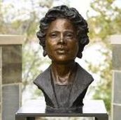 In November, the city of Little Rock installed National Sculptors' Guild Fellow Jane DeDecker's Bust of Daisy Lee Gatson Bates in Little Rock, AR.  The bronze of the civil rights activist, Arkansas NAACP president, and pioneering black journalist (1914-1999), is situated in Vogel Schwartz Sculpture Park in her former hometown. The portrait is just one acknowledgment of Bates’ legacy in the river town which also boasts a Daisy Bates Museum, several named streets, and a “Daisy Bates Day” celebrated the third Monday of February every year.  The bust also includes a plaque with a quote by the human rights advocate:   “When hate won’t die, use it for good.”  The outdoor sculpture walk winds along the Arkansas River and includes 90 works of art in its collection.   Daisy Gatson Bates, who was a mentor to the Little Rock Nine, a civil rights activist, a former Arkansas NAACP president and a pioneering Black journalist, is now commemorated with a bronze bust sculpted by Jane DeDecker and the National Sculptors' Guild, along the banks of the Arkansas River.   At-large Director Dean Kumpuris, a longtime advocate for the development of Little Rock’s riverfront, has worked to add yet another art piece to the River Market Sculpture Garden. Joining 90 other artworks, the Bates sculpture also includes a backing wall made of natural blue stones that represent the river.   Along with the new sculpture, Bates’ legacy is also celebrated at the Daisy Bates Museum, her former home and now National Historic Landmark — also in Little Rock. The third Monday in February is recognized as “Daisy Gatson Bates Day” in Arkansas, and various streets in the state are named after her.  The city of Little Rock announced the sculpture Tuesday, and Kumpuris said, “I can think of no more fitting addition to the more than 90 artworks in the Vogel Schwartz Sculpture Garden than one honoring Daisy Bates, whose contributions to Little Rock through activism and journalism are still with us today.”  Below the bust, a plaque reads “When hate won’t die, use it for good.”   The work was donated by the nonprofit group Sculpture at the River Market, and the Little Rock Parks and Recreation Department installed it.  Leland Couch, the director of the parks department, echoed compliments of Bates. He said that it is a “distinct privilege” to honor someone who “fought so hard to make Little Rock a city for everyone.”  The Bates sculpture is near the Main Street overpass on the Eastern side of the art garden.