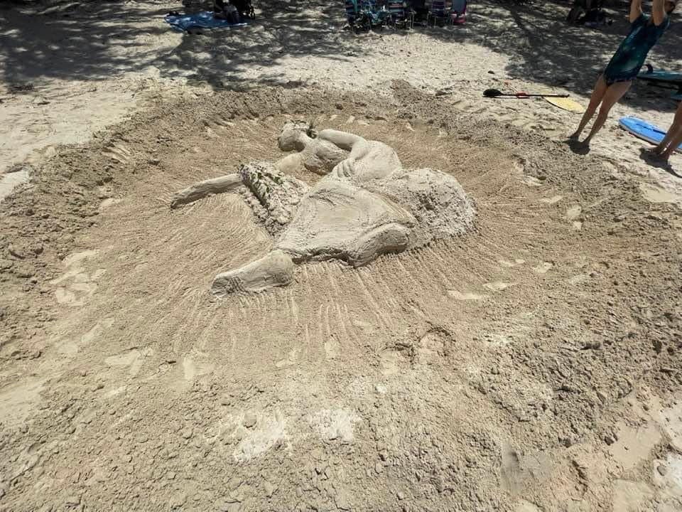 #WIPwednesday As we mentioned a couple weeks ago, Jane DeDecker and the National Sculptors' Guild were selected by the Hawaii State Foundation on Culture and the Arts for a sculpture placement at their renovated Ho'okipa Cottages, a part of the Women's Correctional Facility.  After our initial site visit, Jane worked through some conceptual 'sketching' in the sand. All we can say is she #NailedIt! We can't wait to see what she does back in the studio for the monument. Sculptors are incredible.  Jane DeDecker's design is of a female figure seated with outstretched arm draped in Hawaiian lei’s that she is offering to her fellow Hawaiians and the island at large; in an expression of aloha; compassion, gratitude and acceptance.  Learn more about the project and see the progress on our feed: https://www.nationalsculptorsguild.com/.../hookipa-by...  #IdeasInTheSand #SandArt #ConceptDesign #Brainstorming #NationalSculptorsGuild #JaneDeDecker #Hookipa #Aloha #BronzeSculpture #DeDeckerBronze #HawaiiStateArtCommission #SFCA #JKdesignsInc #HomeDecor #CorporateCollections #ArtInPublicPlaces #ArtistDriven #ClientMinded #Since1992 #NSG #FineArtSculpture