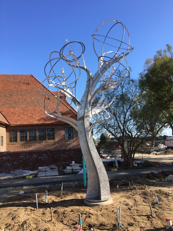 “Mockingbird/Orange Tree” by Michael Warrick and the National Sculptors’ Guild is installed at The Groves Whittier in California.
The 18-ft Stainless Steel stylized tree sculpture features a half dozen gold-leaf oranges and a single mockingbird.
We are thrilled that this installation was able to be completed during less than ideal circumstances due to CoVid19. Our team worked well alongside Brookfield SoCal to install the sculpture. It was important to get it placed so that The Groves can complete their land and hardscaping and complete this beautiful new community. Thanks for everyone’s great effort! We hope the piece becomes an iconic centerpiece for the neighborhood and can’t wait to see it finished.
​#MichaelWarrick #NationalSculptorsGuild #WhittierCA #TheGroves #MockOrange #Sculpture #PublicArt #WIP #Installation #SunnyCalifornia #BrookfieldSoCal #StainlessSteel #GoldLeaf #Process